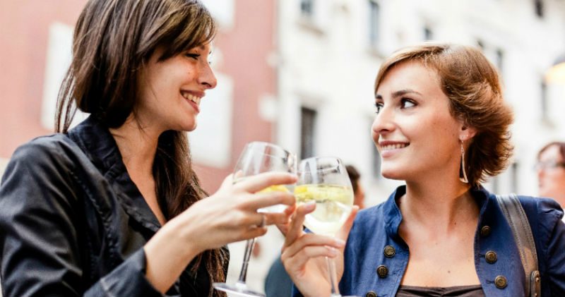 2 women drinking white wine