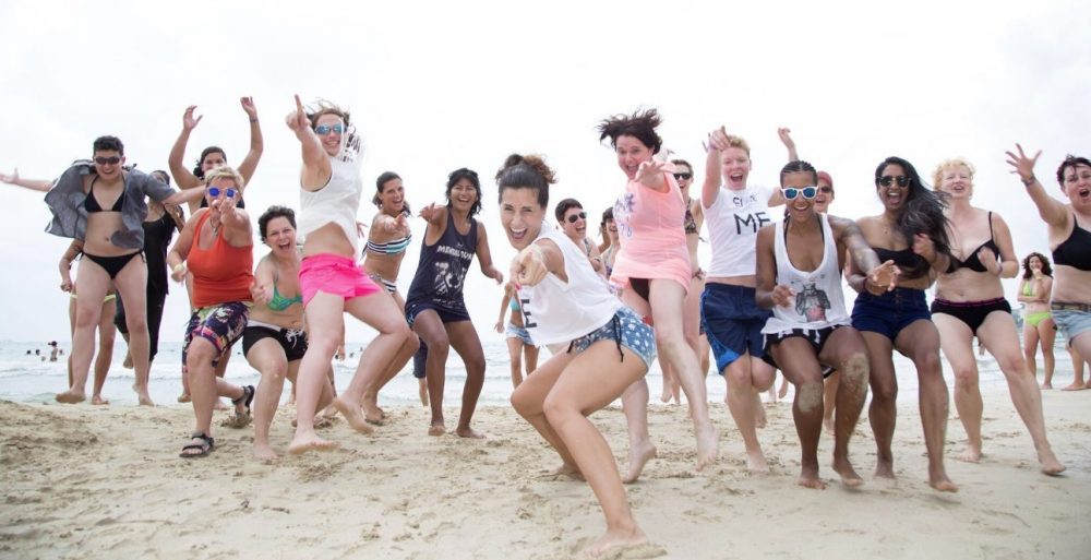 group of women on the beach at ella festival