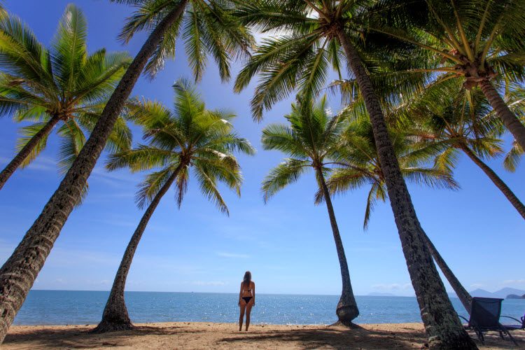 woman standing on the beach in Palm Cove, Cairns woman standing on the beach in Palm Cove, Cairns