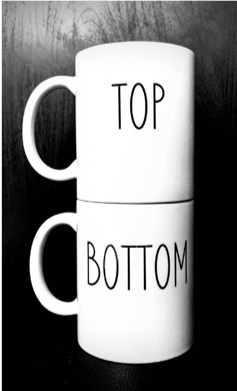 2 white mugs with top and bottom writing 2 white mugs with top and bottom writing